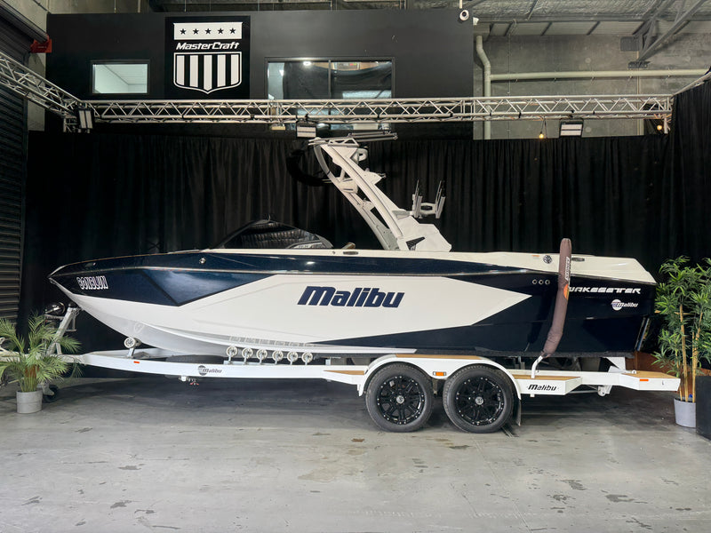 2024 Malibu Wakesetter 23 LSV — side-on view against black showroom curtains