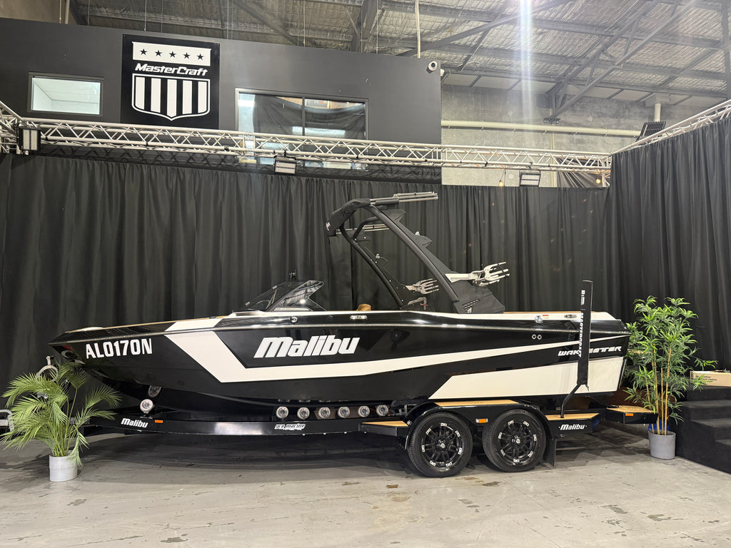 2022 Malibu 21LX — black and white side profile against black showroom backdrop